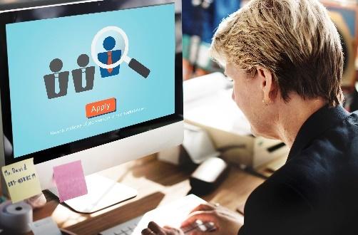 Person at computer filling online job application