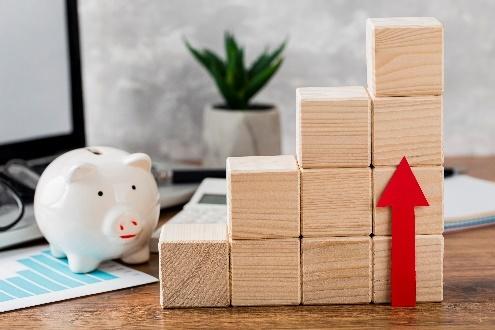 Piggy bank and blocks showing financial growth