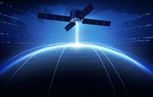 Satellite beaming data to Earth in space.