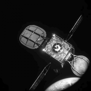 Black and white satellite spacecraft above Earth