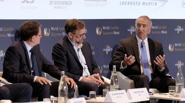 Business conference panel discussion with three men
