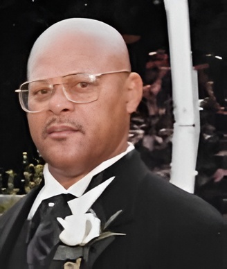 Man in tuxedo wearing white boutonniere