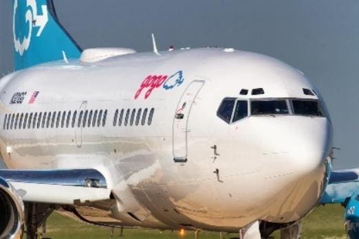 Close-up of the front section of a commercial airplane on the runway.