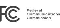 Logo of the Federal Communications Commission with a stylized FCC symbol.