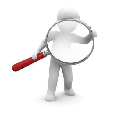 3D figure holding large magnifying glass