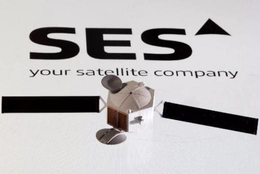 Model of a SES telecommunications satellite with solar panels.