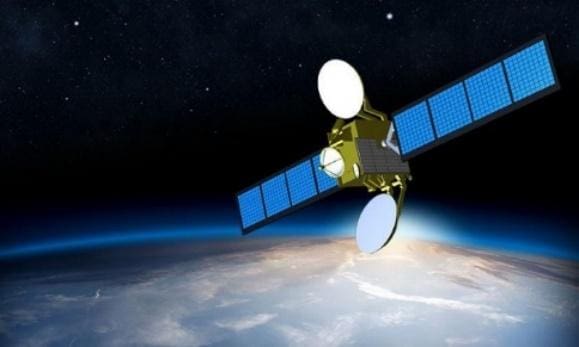 Satellite orbiting Earth against a starry space backdrop.