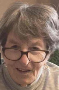 Older woman wearing glasses, close-up smiling