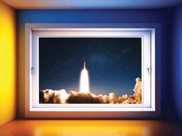 A rocket launching viewed through a window at night.