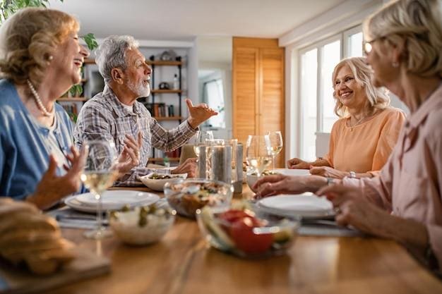 Family enjoying a lively meal together at the dining table.