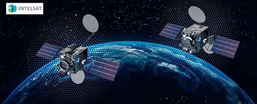 Two Intelsat satellites orbiting over Earth