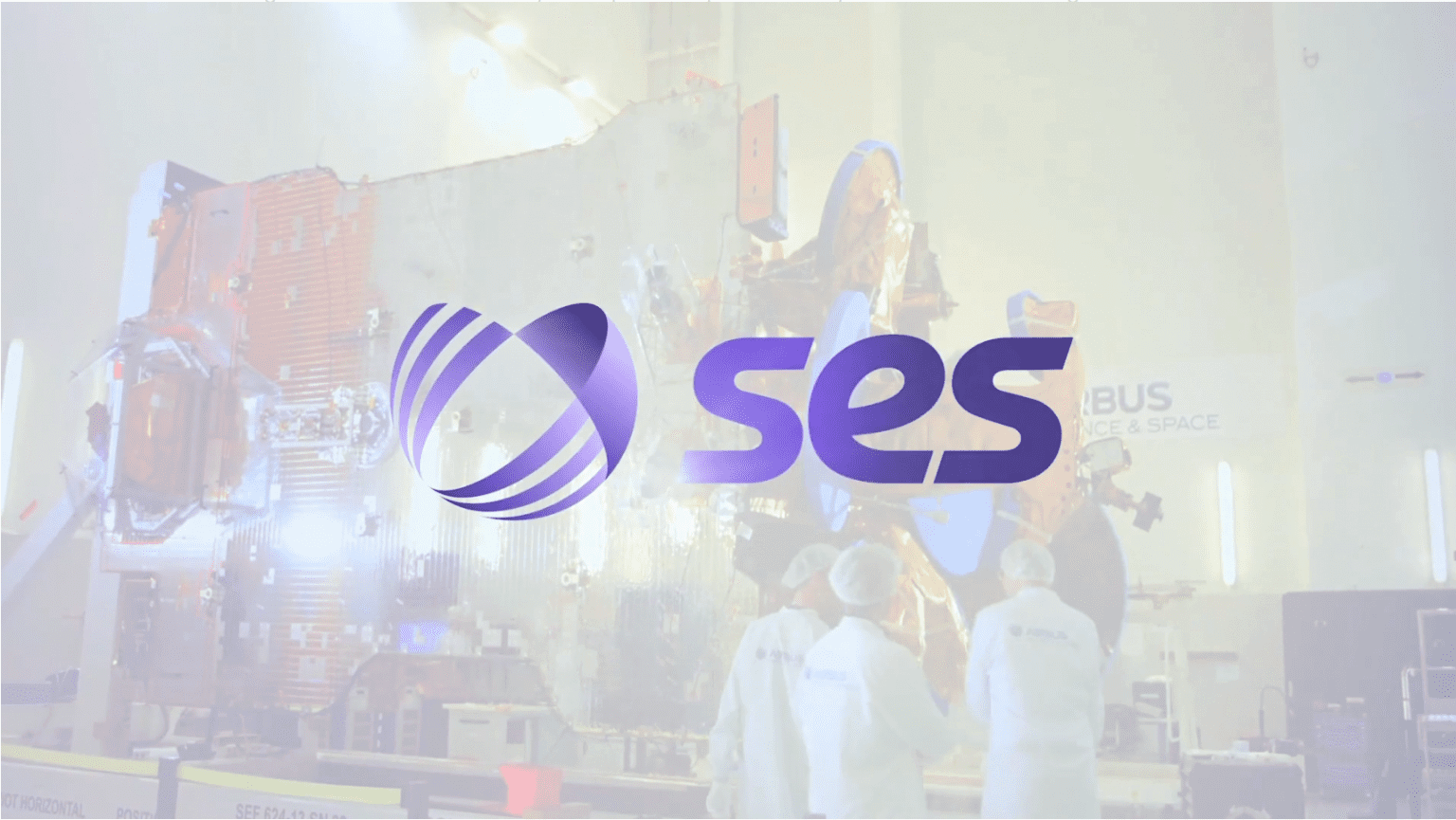 SES logo on satellite assembly background.