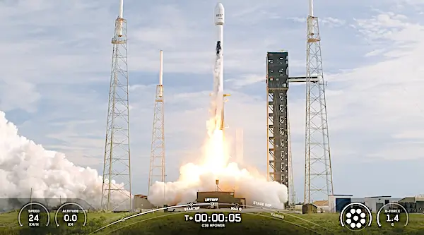 Falcon rocket liftoff with smoke and flames