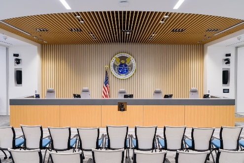 Empty conference room with official emblem displayed.