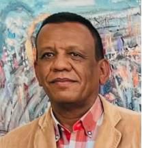 Man in jacket with colorful painting background.