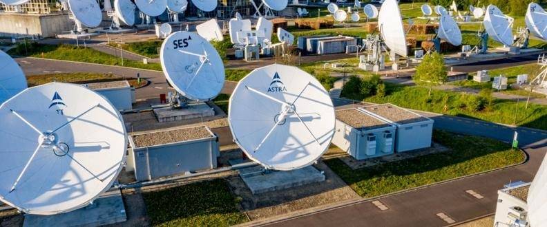 Satellite dishes in an outdoor communications facility.