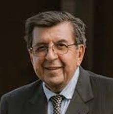 Elderly man in a suit and tie.