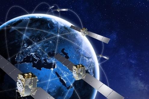Satellites orbiting Earth with digital connections.