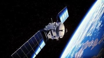 Orbital communications satellite with extended solar arrays