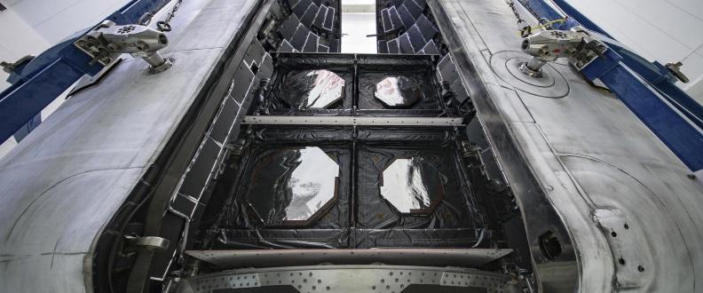 Spacecraft interior with open hatch doors.