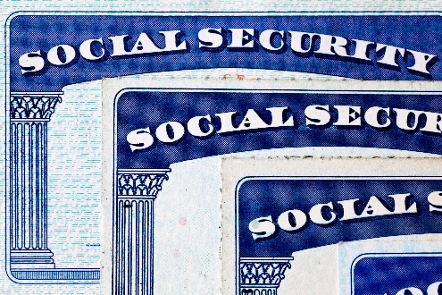 Social Security cards with blue borders.