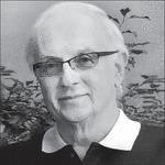 Black-and-white portrait of older man with glasses