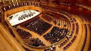 Large concert hall with orchestra and audience