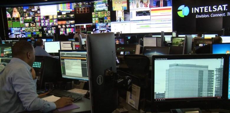 Broadcast control room with multiple video monitors