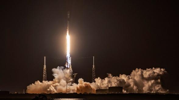 night rocket launching with smoke plume