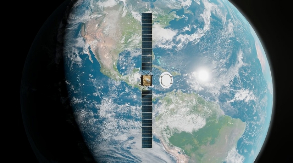 Satellite with long vertical solar arrays above Americas