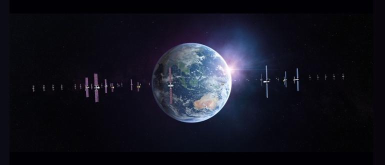 Earth with line of satellites and sunrise