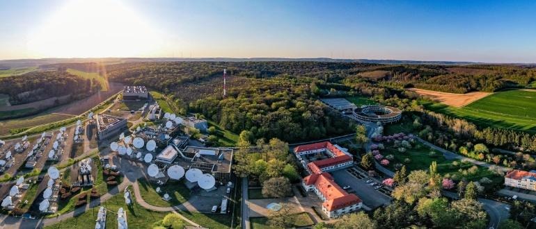 Aerial view of satellite dish array and campus