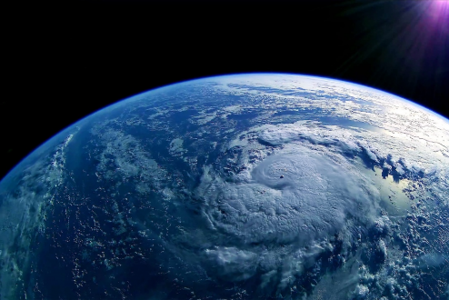 Earth view from space showing swirling hurricane