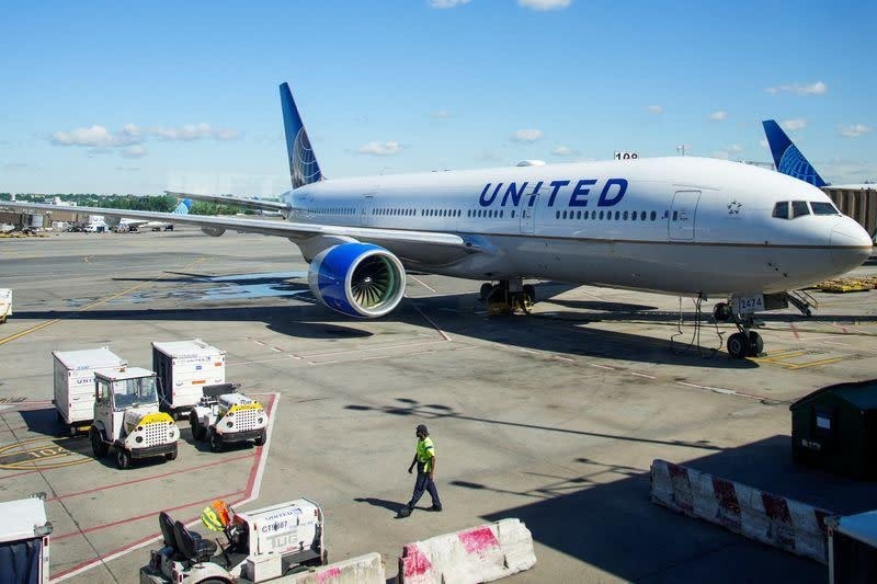 United airplane parked at airport gate
