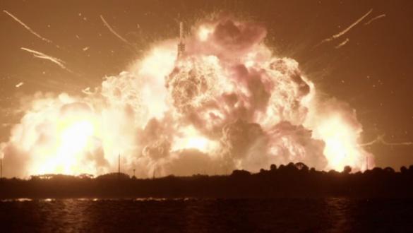 Massive fiery explosion over coastal skyline