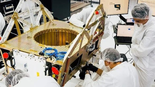 Image credit <a href="https://www.luxtimes.lu/">Luxembourg Times:</a> An undated photo of technicians working on a satellite at Apex Technology’s Los Angeles factory. © Photo credit: LW archive